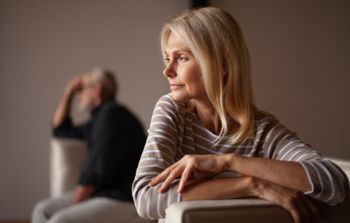 couple embracing woman looks relieved